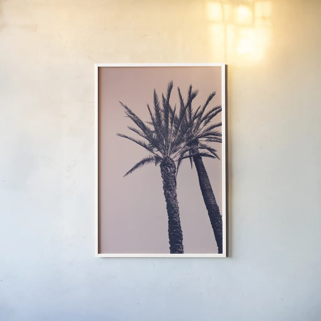 Pink Palms I by Deborah Revell. shown as a paper print in a white frame. Available as a archival giclee rolled canvas, fine art paper, or poster print. SKU 94375h.