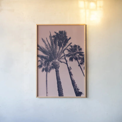 Pink Palms II by Deborah Revell. shown as a paper print in a natural frame. Available as a archival giclee rolled canvas, fine art paper, or poster print. SKU 94376h.