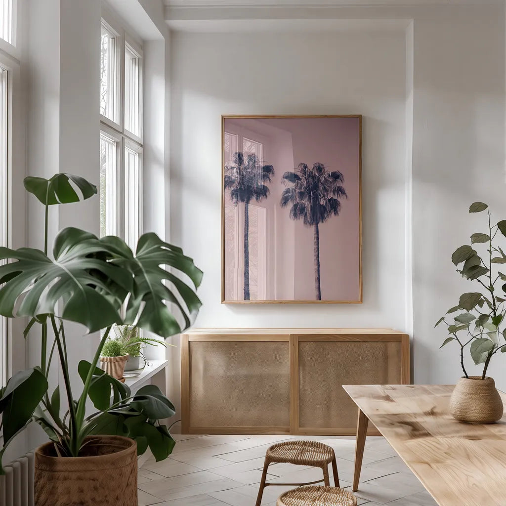 Pink Palms III by Deborah Revell. shown as a print in a natural wood frame in a dining room. Available as a archival giclee rolled canvas, fine art paper, or poster print. SKU 101783h.