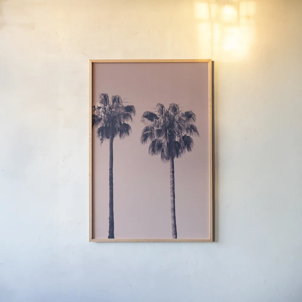 Pink Palms III by Deborah Revell. shown as a paper print in a natural frame. Available as a archival giclee rolled canvas, fine art paper, or poster print. SKU 101783h.
