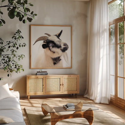Pippa the Goat III by Deborah Revell. Shown in a natural wood frame in a cozy modern living room. Available as an archival giclee rolled canvas, fine art paper, or poster print. SKU 96299a.