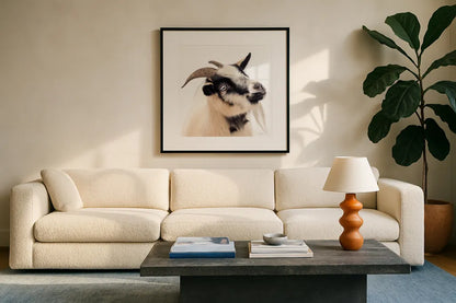 Pippa the Goat III by Deborah Revell. Displayed in a glass frame with matte in a clean modern living room. Available as an archival giclee rolled canvas, fine art paper, or poster print. SKU 96299a.