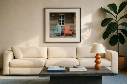 Porch Chairs by Deborah Revell. Displayed in a glass frame with matte in a clean modern living room. Available as an archival giclee rolled canvas, fine art paper, or poster print. SKU 94578a.