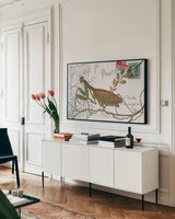 Praying Mantis Postcard by Deborah Revell. shown as a framed stretched canvas in a living room above a console. Available as a archival giclee rolled canvas, fine art paper, or poster print. SKU 91116i.