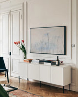 Reeds on the Ley V by Deborah Revell. shown as a framed stretched canvas in a living room above a console. Available as a archival giclee rolled canvas, fine art paper, or poster print. SKU 91123i.