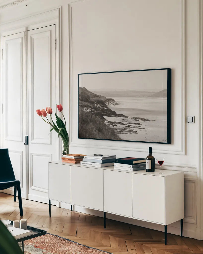 Rock Beach by Deborah Revell. shown as a framed stretched canvas in a living room above a console. Available as a archival giclee rolled canvas, fine art paper, or poster print. SKU 101000i.