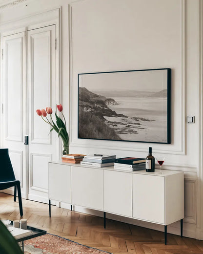 Rock Beach by Deborah Revell. shown as a framed stretched canvas in a living room above a console. Available as a archival giclee rolled canvas, fine art paper, or poster print. SKU 101000i.