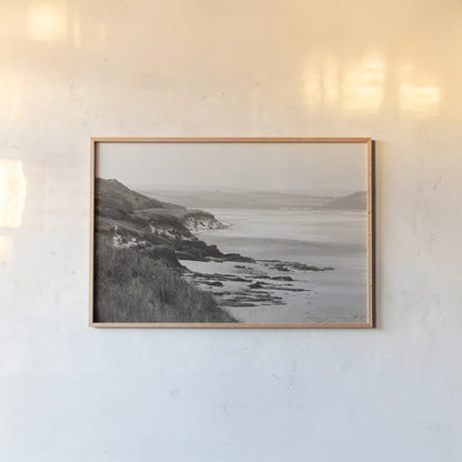 Rock Beach by Deborah Revell. shown as a paper print in a natural frame. Available as a archival giclee rolled canvas, fine art paper, or poster print. SKU 101000i.