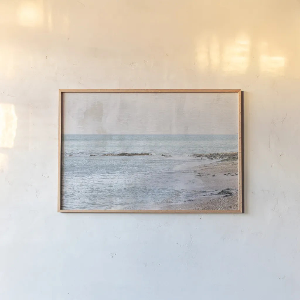 Secret Beach by Deborah Revell. shown as a paper print in a natural frame. Available as a archival giclee rolled canvas, fine art paper, or poster print. SKU 94274i.