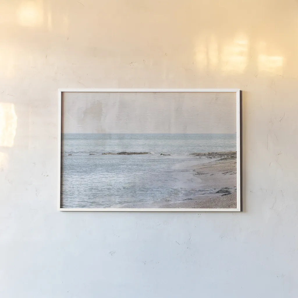 Secret Beach by Deborah Revell. shown as a paper print in a white frame. Available as a archival giclee rolled canvas, fine art paper, or poster print. SKU 94274i.