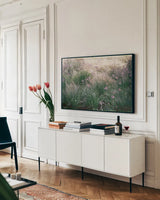 Secret Garden III by Deborah Revell. shown as a framed stretched canvas in a living room above a console. Available as a archival giclee rolled canvas, fine art paper, or poster print. SKU 94366i.