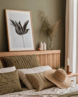Sepia Tulip II by Deborah Revell. shown as a paper print in a natural frame. Available as a archival giclee rolled canvas, fine art paper, or poster print. SKU 93419h.
