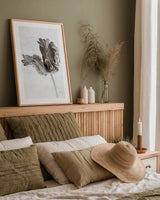 Sepia Tulip III by Deborah Revell. shown as a paper print in a natural frame. Available as a archival giclee rolled canvas, fine art paper, or poster print. SKU 93420h.