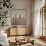 Sepia Wheat by Deborah Revell. Shown in a natural wood frame in a cozy modern living room. Available as an archival giclee rolled canvas, fine art paper, or poster print. SKU 104325a.