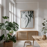 Simple Eucalyptus III by Deborah Revell. shown as a print in a natural wood frame in a dining room. Available as a archival giclee rolled canvas, fine art paper, or poster print. SKU 102716h.