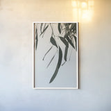 Simple Eucalyptus III by Deborah Revell. shown as a paper print in a white frame. Available as a archival giclee rolled canvas, fine art paper, or poster print. SKU 102716h.