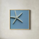 Starfish I by Deborah Revell. Shown in a natural wood glass frame for a timeless modern aesthetic. Available as an archival giclee rolled canvas, fine art paper, or poster print. SKU 96628a.
