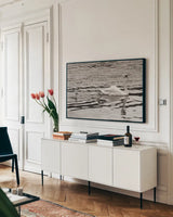 Swan Family Sepia by Deborah Revell. shown as a framed stretched canvas in a living room above a console. Available as a archival giclee rolled canvas, fine art paper, or poster print. SKU 96819i.