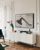 The Axe by Deborah Revell. shown as a framed stretched canvas in a living room above a console. Available as a archival giclee rolled canvas, fine art paper, or poster print. SKU 96608i.