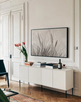 Tidegrass II by Deborah Revell. shown as a framed stretched canvas in a living room above a console. Available as a archival giclee rolled canvas, fine art paper, or poster print. SKU 102087i.