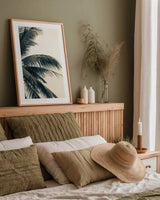 Tropical Palm I by Deborah Revell. shown as a paper print in a natural frame. Available as a archival giclee rolled canvas, fine art paper, or poster print. SKU 104962h.