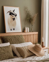 Two Little Goats I by Deborah Revell. shown as a paper print in a natural frame. Available as a archival giclee rolled canvas, fine art paper, or poster print. SKU 96308h.