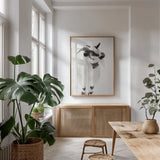 Two Little Goats I BW by Deborah Revell. shown as a print in a natural wood frame in a dining room. Available as a archival giclee rolled canvas, fine art paper, or poster print. SKU 96310h.