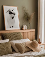Two Little Goats I BW by Deborah Revell. shown as a paper print in a natural frame. Available as a archival giclee rolled canvas, fine art paper, or poster print. SKU 96310h.
