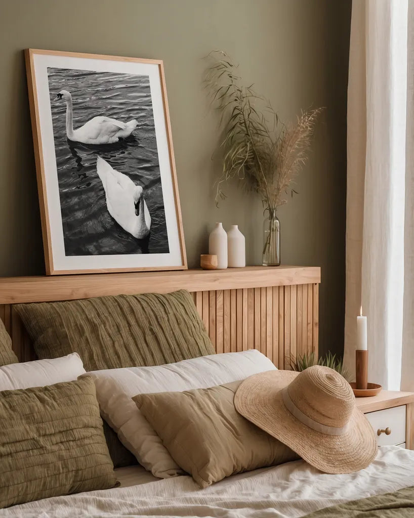 Two Swans by Deborah Revell. shown as a paper print in a natural frame. Available as a archival giclee rolled canvas, fine art paper, or poster print. SKU 96814h.