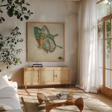 Vintage Aqua Butterfly by Deborah Revell. Shown in a natural wood frame in a cozy modern living room. Available as an archival giclee rolled canvas, fine art paper, or poster print. SKU 91129a.