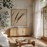 Whispering Rushes I by Deborah Revell. Shown in a natural wood frame in a cozy modern living room. Available as an archival giclee rolled canvas, fine art paper, or poster print. SKU 104295a.