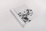White Rose III BW by Deborah Revell. shown as a rolled paper print. Available as archival giclee rolled canvas, fine art paper, or poster print. SKU 92614h.