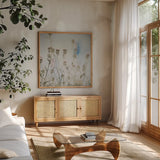 Wild Flowers I by Deborah Revell. Shown in a natural wood frame in a cozy modern living room. Available as an archival giclee rolled canvas, fine art paper, or poster print. SKU 91252a.