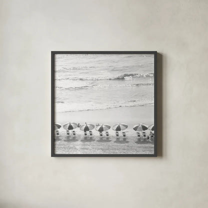 A Day At The Beach BW Crop by Debra Van Swearingen. Shown in a sleek black glass frame for a contemporary gallery look. Available as an archival giclee rolled canvas, fine art paper, or poster print. SKU 77150a.