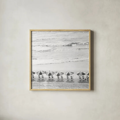 A Day At The Beach BW Crop by Debra Van Swearingen. Shown in a natural wood glass frame for a timeless modern aesthetic. Available as an archival giclee rolled canvas, fine art paper, or poster print. SKU 77150a.