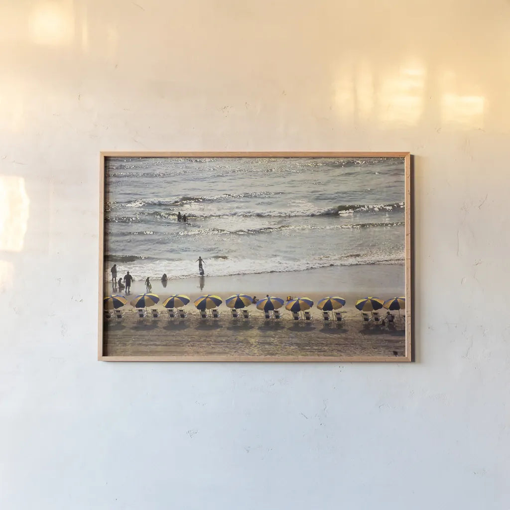 A Day at the Beach by Debra Van Swearingen. shown as a paper print in a natural frame. Available as a archival giclee rolled canvas, fine art paper, or poster print. SKU 47846i.