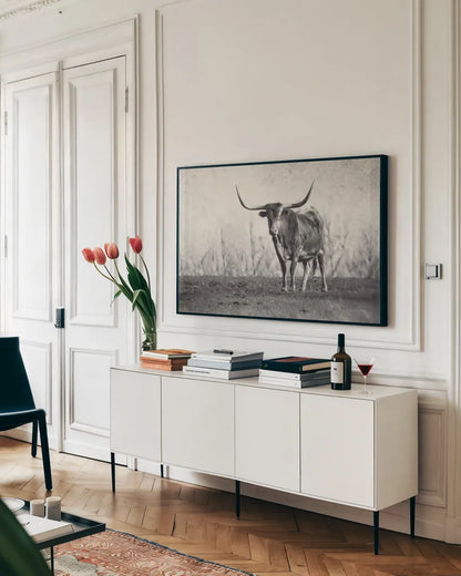 A Texas Longhorn by Debra Van Swearingen. shown as a framed stretched canvas in a living room above a console. Available as a archival giclee rolled canvas, fine art paper, or poster print. SKU 81058i.