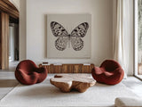 Butterfly V Gray by Debra Van Swearingen. Shown as extra-large giant wall art in a modern living room. Available as an archival giclee rolled canvas, fine art paper, or poster print. SKU 92345a.