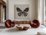 Butterfly V Gray by Debra Van Swearingen. Shown as extra-large giant wall art in a modern living room. Available as an archival giclee rolled canvas, fine art paper, or poster print. SKU 92347a.