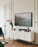 Coastal Fog I by Debra Van Swearingen. shown as a framed stretched canvas in a living room above a console. Available as a archival giclee rolled canvas, fine art paper, or poster print. SKU 81259i.