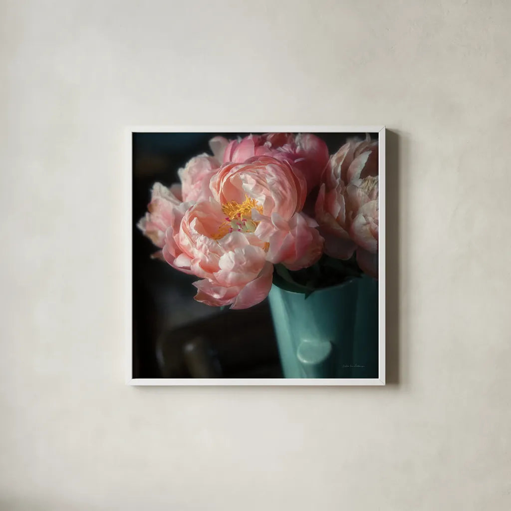 Coral Peonies I by Debra Van Swearingen. Shown in a crisp white glass frame for a clean and minimalist style. Available as an archival giclee rolled canvas, fine art paper, or poster print. SKU 86250a.
