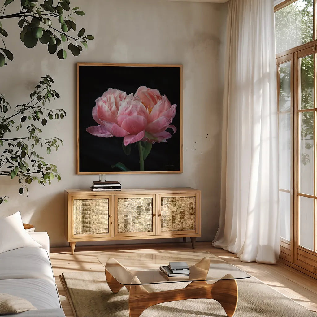Coral Peonies IV by Debra Van Swearingen. Shown in a natural wood frame in a cozy modern living room. Available as an archival giclee rolled canvas, fine art paper, or poster print. SKU 86253a.