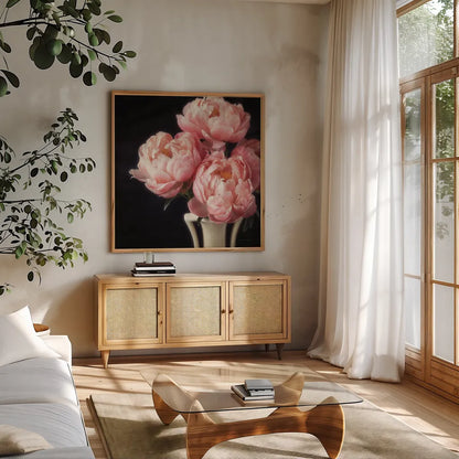 Coral Peonies VI by Debra Van Swearingen. Shown in a natural wood frame in a cozy modern living room. Available as an archival giclee rolled canvas, fine art paper, or poster print. SKU 86255a.