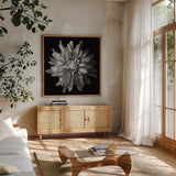 Dahlia V BW by Debra Van Swearingen. Shown in a natural wood frame in a cozy modern living room. Available as an archival giclee rolled canvas, fine art paper, or poster print. SKU 89726a.