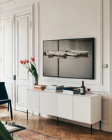 Dories by Debra Van Swearingen. shown as a framed stretched canvas in a living room above a console. Available as a archival giclee rolled canvas, fine art paper, or poster print. SKU 90961i.