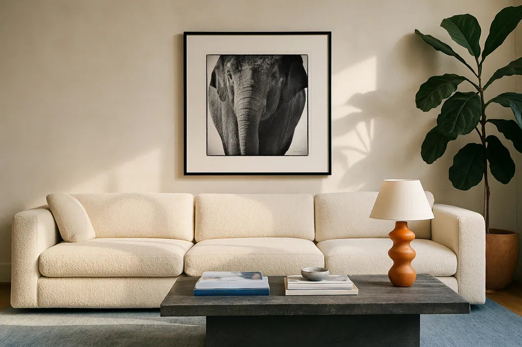 Elephant I by Debra Van Swearingen. Displayed in a glass frame with matte in a clean modern living room. Available as an archival giclee rolled canvas, fine art paper, or poster print. SKU 19399a.