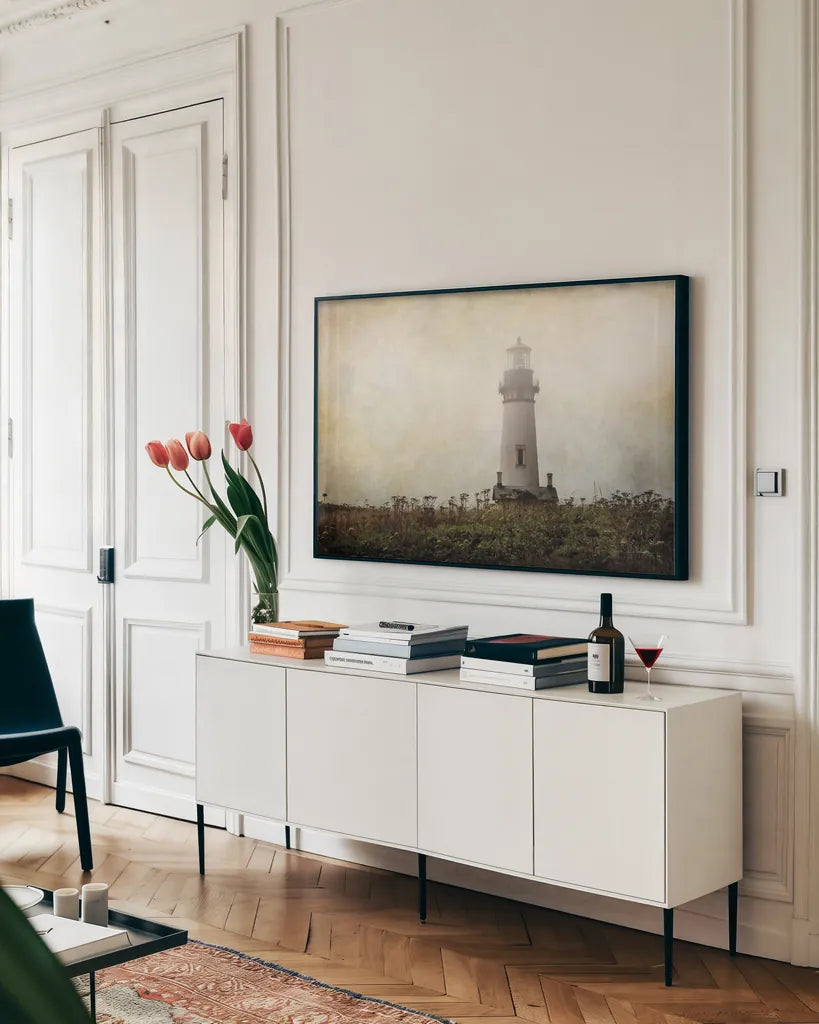 Lonely Lighthouse II by Debra Van Swearingen. shown as a framed stretched canvas in a living room above a console. Available as a archival giclee rolled canvas, fine art paper, or poster print. SKU 47844i.