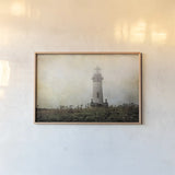 Lonely Lighthouse II by Debra Van Swearingen. shown as a paper print in a natural frame. Available as a archival giclee rolled canvas, fine art paper, or poster print. SKU 47844i.
