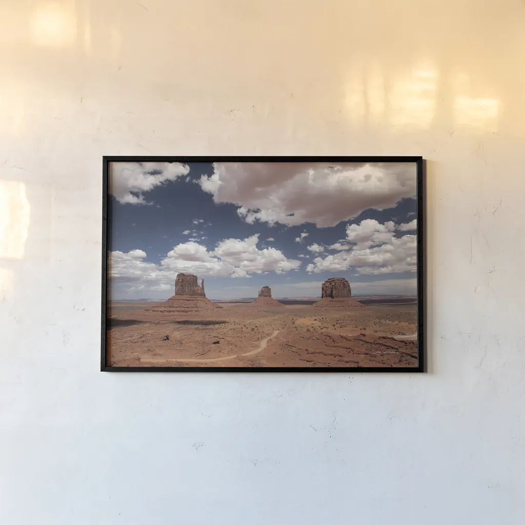 Monument Valley I by Debra Van Swearingen. shown as a paper print in a black flame. Available as a archival giclee rolled canvas, fine art paper, or poster print. SKU 81265i.