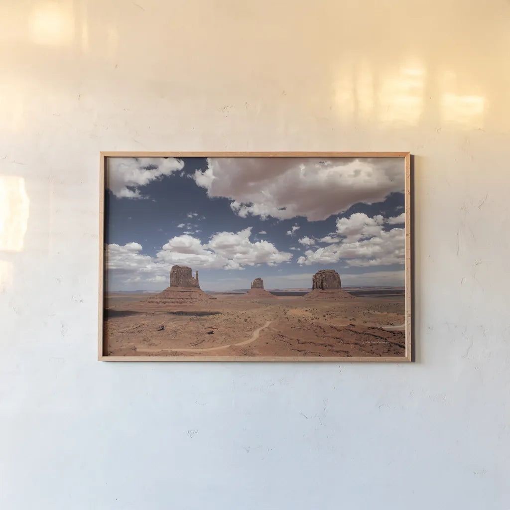 Monument Valley I by Debra Van Swearingen. shown as a paper print in a natural frame. Available as a archival giclee rolled canvas, fine art paper, or poster print. SKU 81265i.
